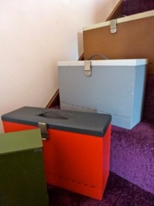 Four metal boxes, 3 with carrying handles, approx 38cm x 26cm x 12cm