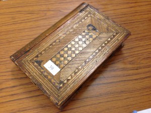 Decorative inlaid straw-work box. 19th Century possibly made by 19th Century French Napoleonic Prisoner of War. Book shaped with drawers and mirror. Sold for £310.