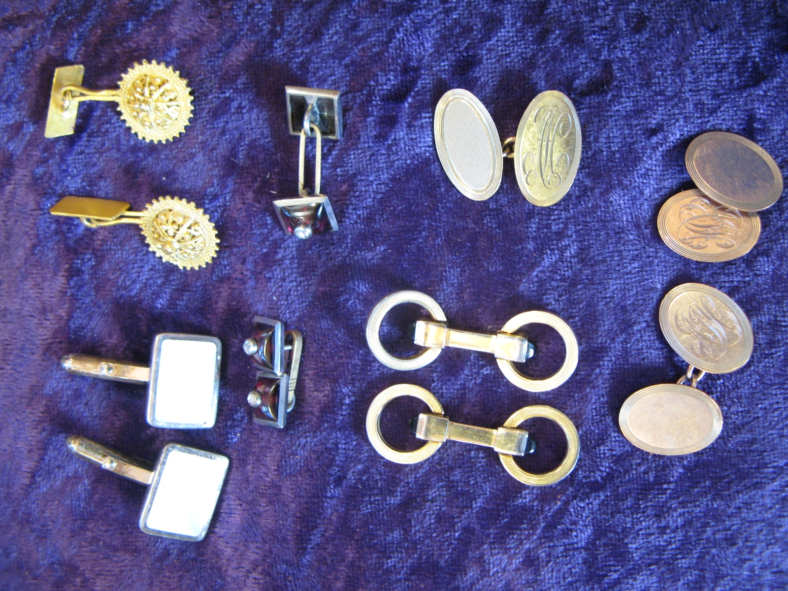 A collection of gold cufflinks - Sold for £100