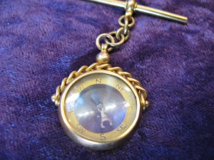 Lot 338 - Compass in gold case, short chain and bar - Sold for £85