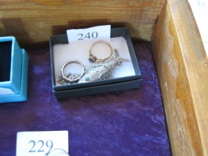 Lot 230 - Two rings and a silver fish brooch - Sold for £37