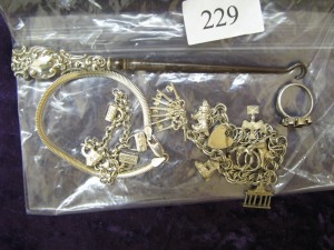 Lot 229 - 925 Silver Charm Bracelet, Charms and Lace Hook - Sold for £75