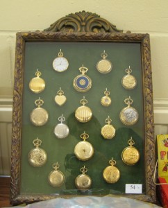 Lot 54 - A collection of pocket watches mounted in a glazed frame - Sold for £50