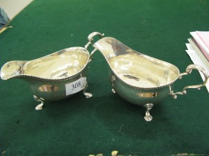 Lot 308 - Two Harrods silver plated sauce boats - Sold for £120