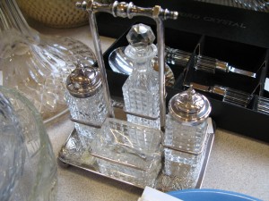 Lot 352 - Cut glass four piece cruet set in silver plated tray - Sold for £40