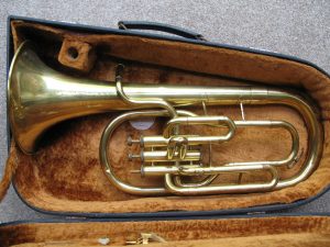 Tenor Horn – Eb – Corton – Foreign with case and music lyre but no mouthpiece. Missing one valve button and 3rd slide is stuck. Otherwise it blows