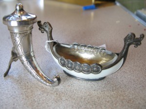 Lot 213 - Two Swedish Silver 925 items - a salt in the form of a Viking longboat and a horn pepper pot - Sold for £55