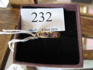 Lot 232 - Gold ring set with multi-coloured stones - Sold for £5