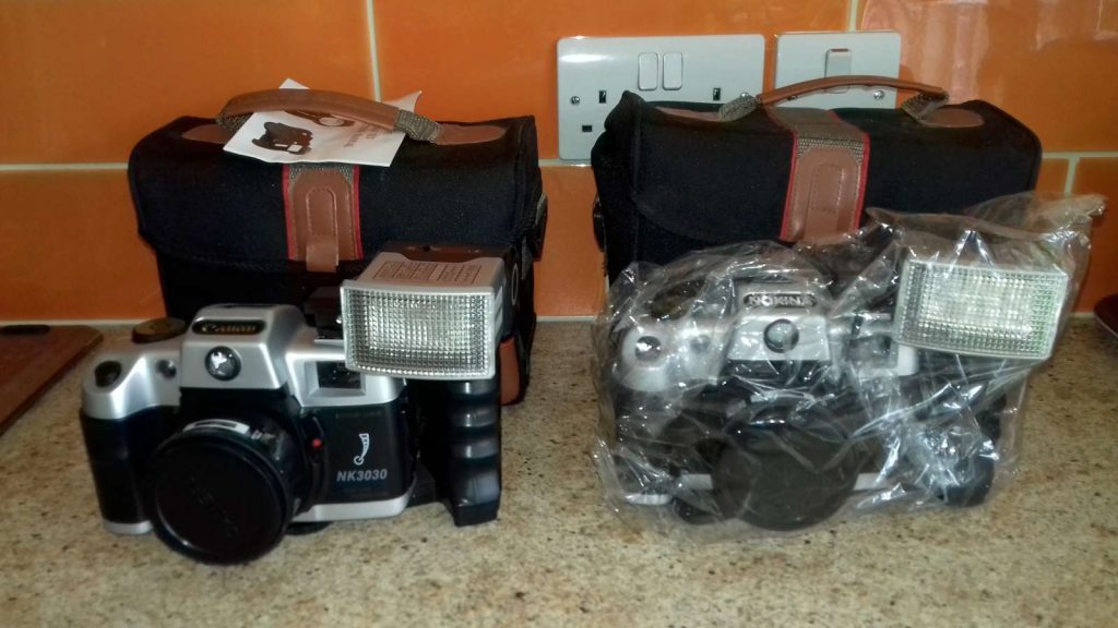 "Canon" and Nokina NK3030 35mm SLR cameras