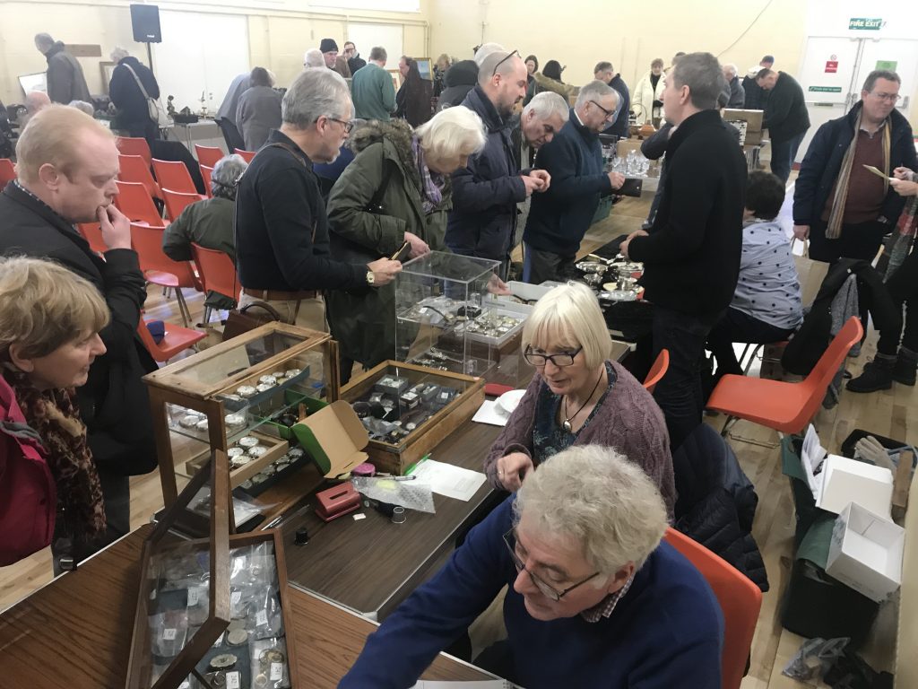 Inspecting the pocket watches, watches and silver at Badger Farm Auction - 2 February 2019