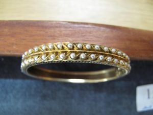 Lot 152 - Gold and seed pearl bangle - Sold for £155