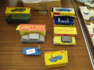 Lot 147 - Dinky Toys: Cars, Electric Vehicle and Military Truck - Sold for £40