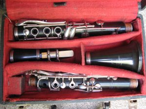 Clarinet – Boosey and Hawkes “77” London. Made of probably Rosewood with a resin bell. In good order with reed, ligature and case. No cap.