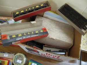 Lot 38 - Box of Trix carriages, tracks and other items - Sold for £40