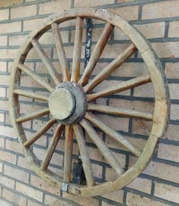Decorative and well-aged Cart Wheel. Complete with metal bracket for fixing to wall. 82 Cm Diameter (approx.)