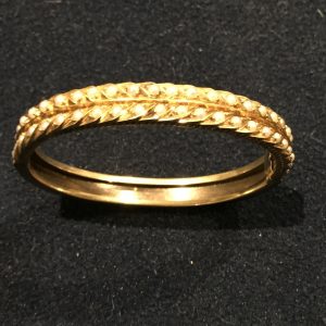 Gold and seeded pearl bangle. Estimate £200-£300