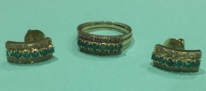 14ct gold emerald ring and earing set fitted in the sapphire mother