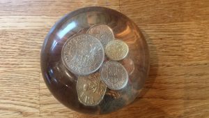 Paperweight with 1948 coins and others