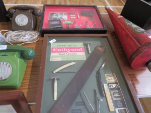 Two Barbers's display cabinets