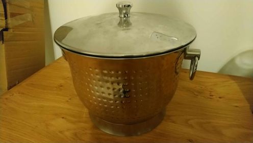 Silver coloured ice bucket