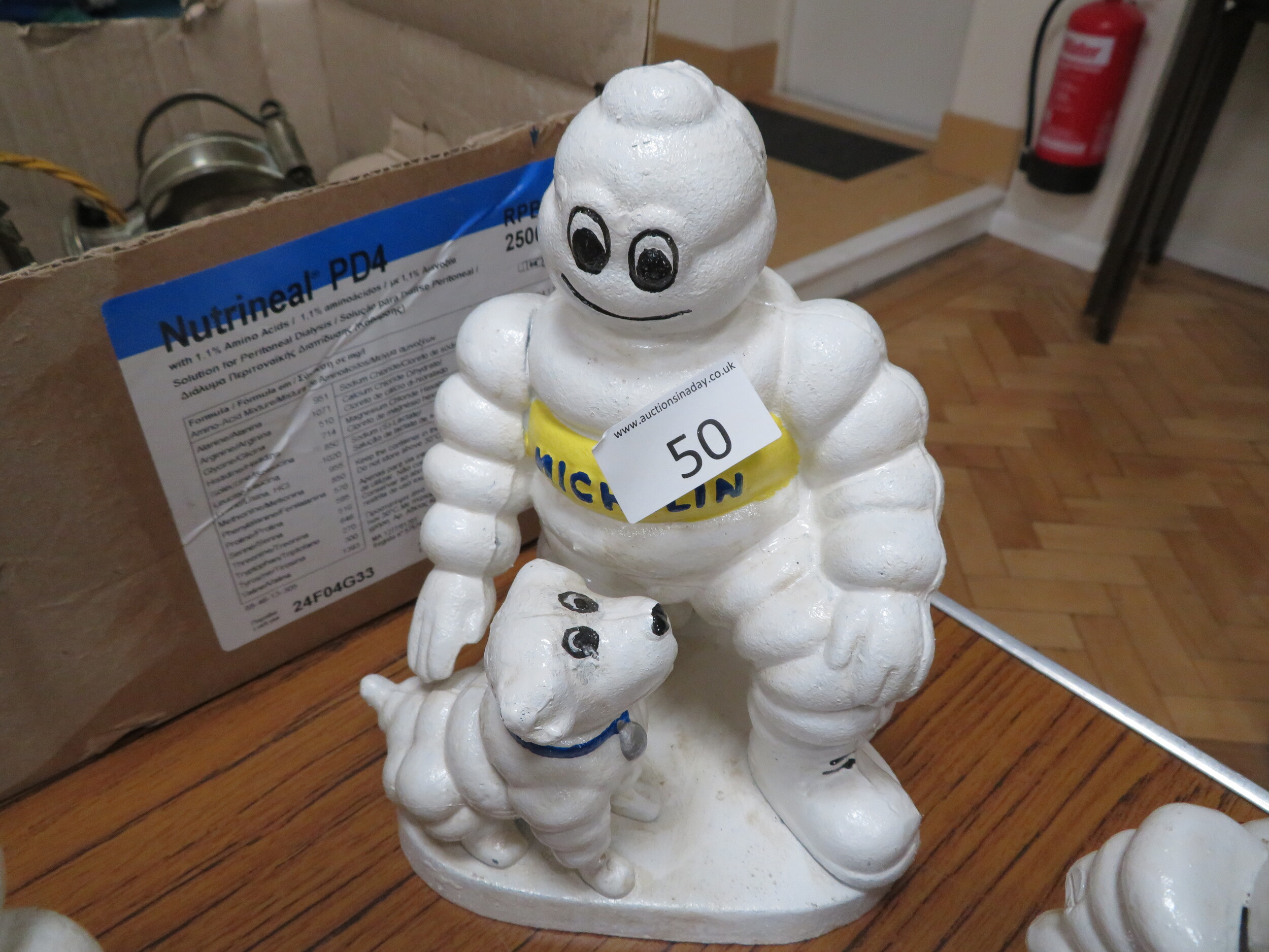 Michelin Man with dog sold for £28