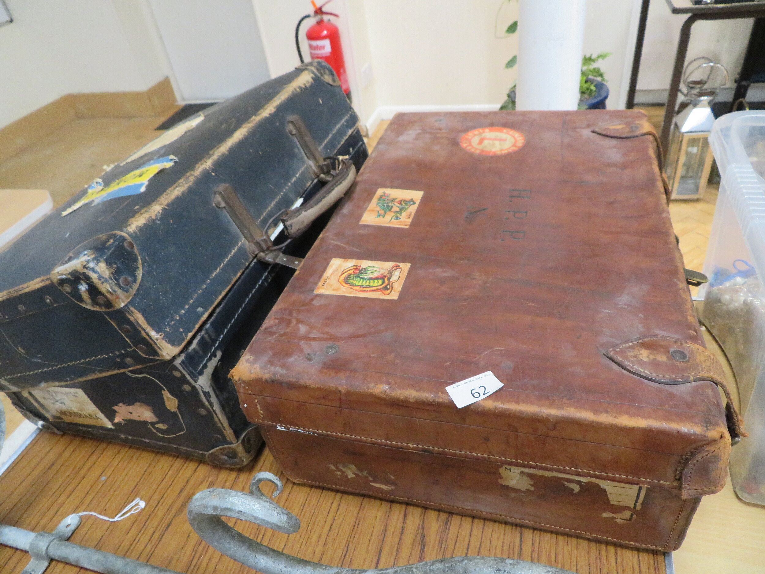 Two leather suitcases containing mixed ephemera sold for £36